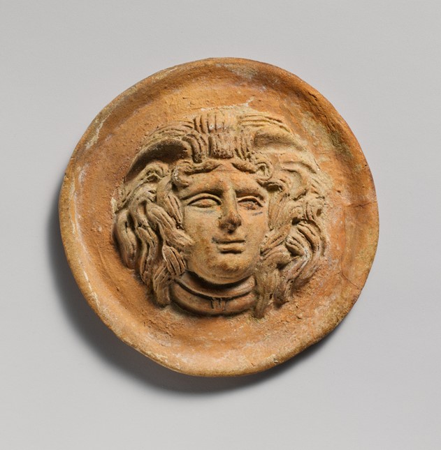 Terracotta reilef roundel with head of Medusa 2nd century B.C. The Metropolitan Museum of Art