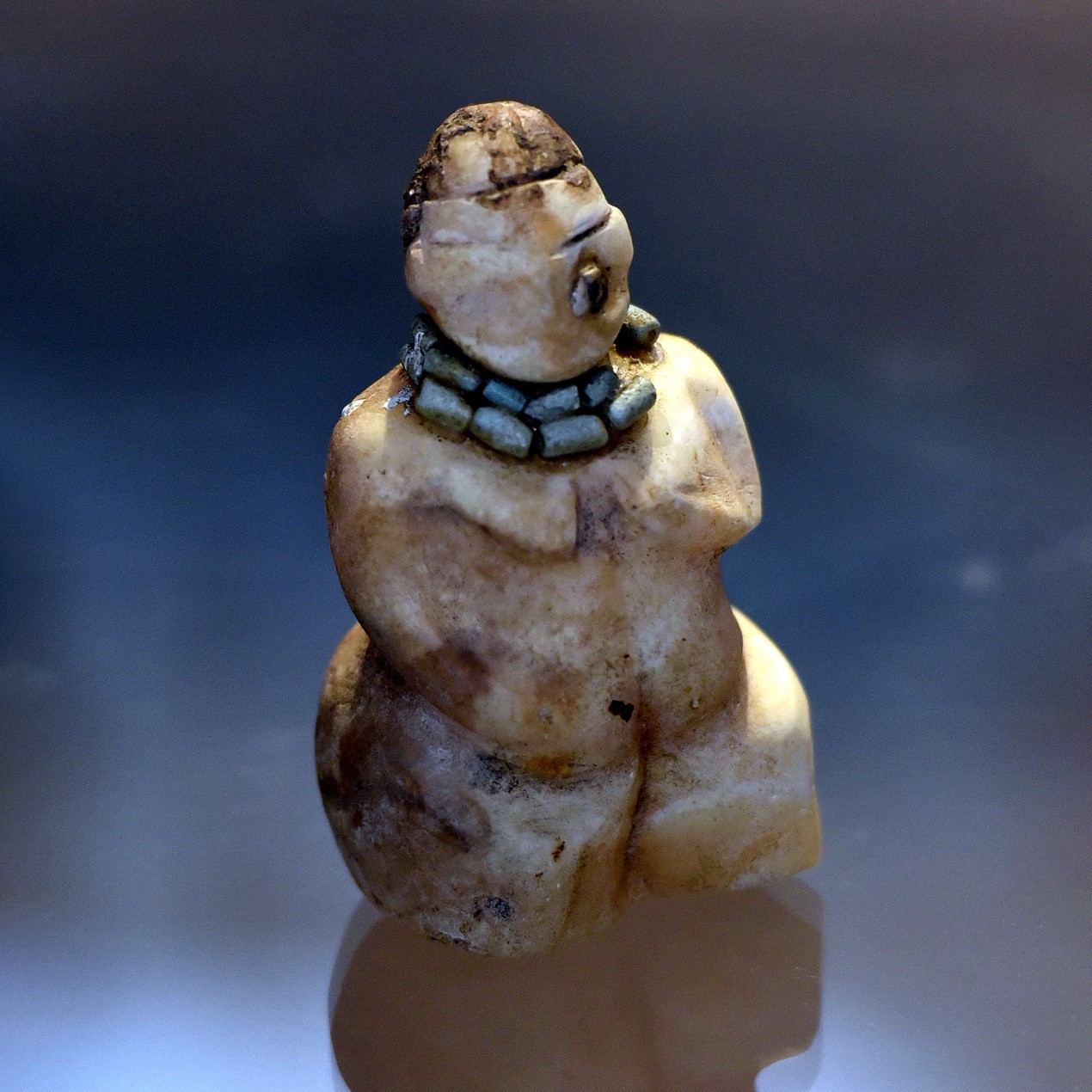 This small marble figurine was found at Tell es-Sawwan. Probably, it represents a mother goddess. The eyes are inlaid with shells set in bitumen. Tell es-Sawwan is an ancient archaeological site in Saladin Province (about 110 Km north of Baghdad) and is associated with the Samarra culture. 6000-5800 BCE. On display at the Iraq Museum in Baghdad, Iraq. Photo: Osama Shukir Muhammed Amin