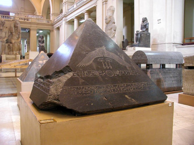 Benben stone from the Pyramid of Amenemhat III, Twelfth Dynasty. Egyptian Museum, Cairo. https://en.wikipedia.org/wiki/Benben#/media/File:Pyramidion_of_the_Pyramid_of_Amenemhet_III_at_Dahshur.jpg